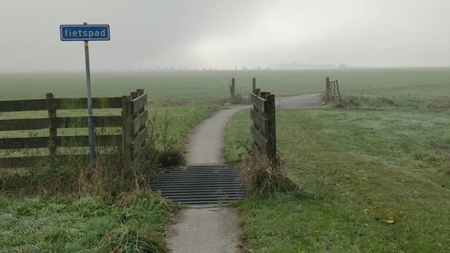 Cycle path in the countryside  in the morning The Netherlands Friesland, Holland