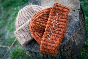 Women's beautiful warm woolen hat with a large knit shot in natural light