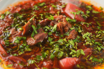 Delicious borscht with lamb, beetroot, herbs and spices