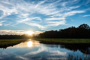 sunset over dutch canal