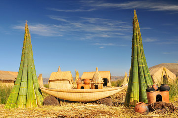 Reed boat on Island of Uros. Titicaca (Titiqaqa) is a lake in the Andes on the border of Peru and...