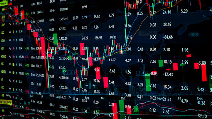 Trading graph on the cityscape at night and world map background,Business financial concept