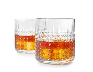 Glasses of whisky on white background