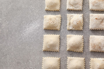 Tasty ravioli on table, top view