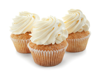 Delicious cupcakes on white background