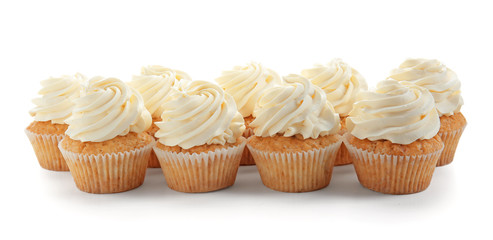 Delicious cupcakes on white background