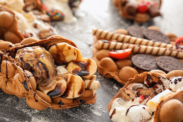 Delicious sweet bubble waffles on grey table