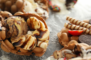 Delicious sweet bubble waffle on grey table
