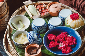 closeup peeling Sweet pomelo on wooden chair and decorate in Traditional thai style