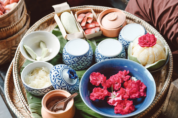 closeup peeling Sweet pomelo on wooden chair and decorate in Traditional thai style