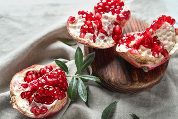 Ripe tasty pomegranate on table