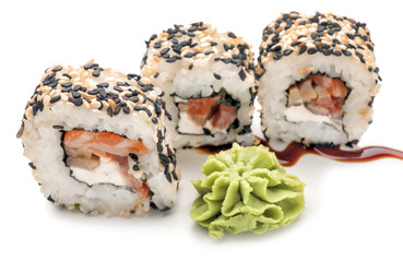 Tasty sushi rolls on white background