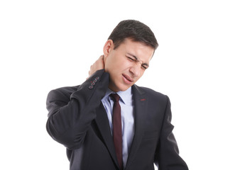 Young businessman suffering from neck pain on white background