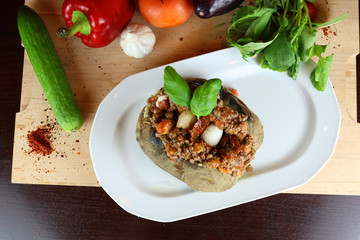 Kumpir - Traditional Turkish meal with baked potato, butter, cheese, bulgur salad, beef meat, mozzarella meat, tomato sauce and hot spices