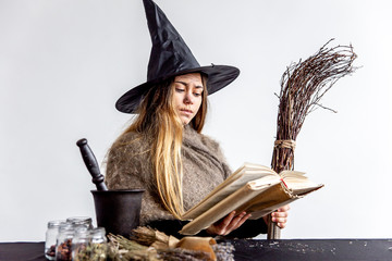 A young woman wearing a witch costume