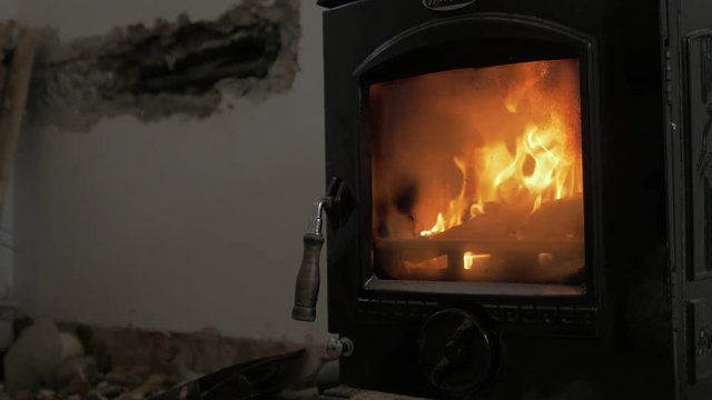 Lovely stove slow motion fire and flames renovating house