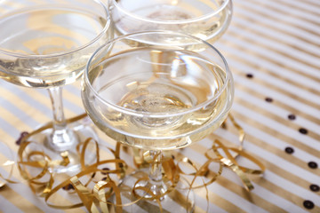 Glasses of champagne on table