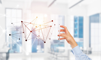 Business and technology concept with networking grid and man using device