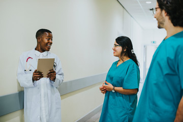Medical team having a conversation in the hallway