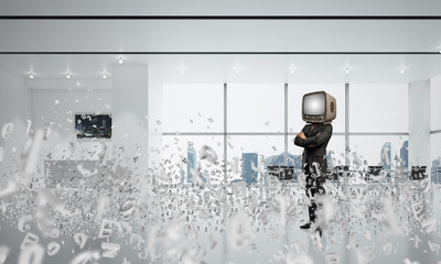 Businessman with an old TV instead of head.