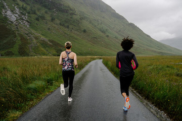 Friends jogging in the Scottish Highlands