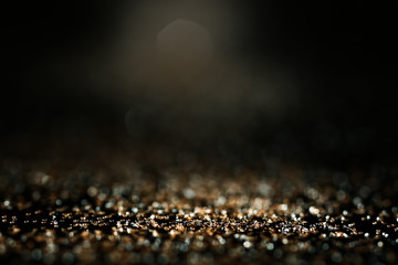 Golden glitters on dark background