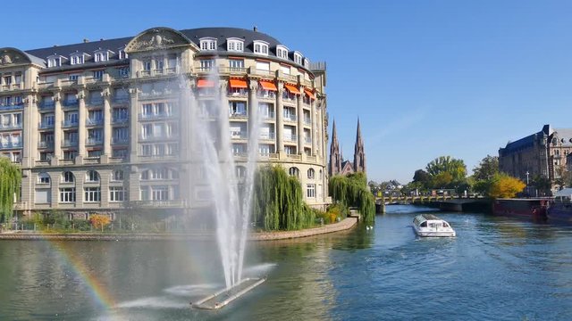Cinemagraph of the city of Strasbourg.The fountain is in motion. There is a rainbow. Cinemagraphs are still photographs in which a minor and repeated movement occurs, forming a video clip.