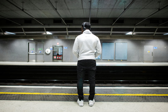 Man waiting at a subway station