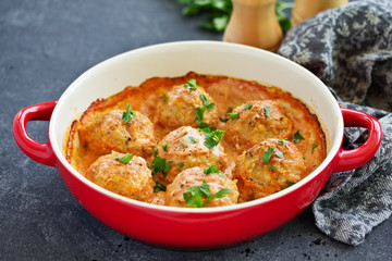 Meatballs in a creamy tomato sauce.