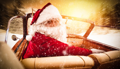 Santa claus in car and snowflakes 