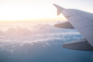 Fototapeta premium Morning light from window of airplane wing