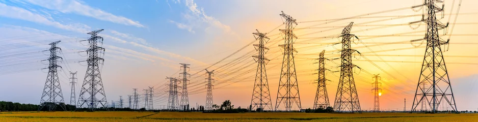 Foto op Canvas high-voltage power lines at sunset,high voltage electric transmission tower © ABCDstock