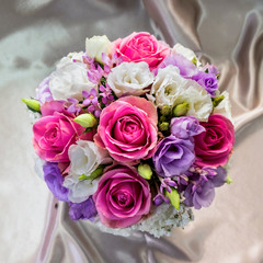 bouquet of flowers on a beige silk background