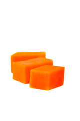 Raw pumpkin cubes. Orange flesh of ripe fruit. Vertical. Isolated on white background.