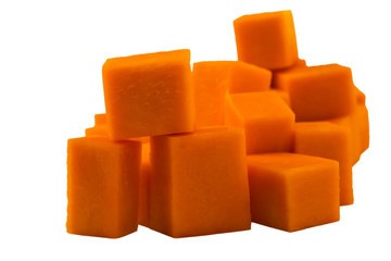 Large cubes of pumpkin pulp. Raw vegetables. Vegetarian food. Isolated on white background.