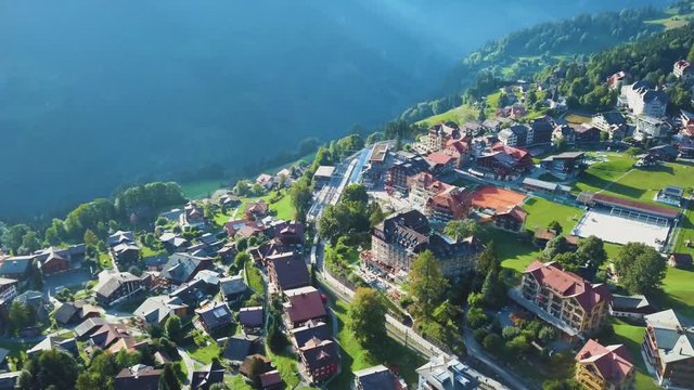 Aerial Revealing Shot, Wengen Town In Alps, Beautiful Morning in Switzerland. 4k