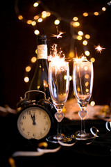 Sylwester, Andrzejki's toast for two. Champagne and fortune telling on a black background. Celebration, lights and new year - obrazy, fototapety, plakaty