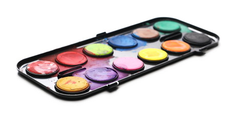 Watercolor pallet and paintbrush isolated on white