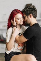  beautiful loving couple in the kitchen, beautiful redheaded girl
