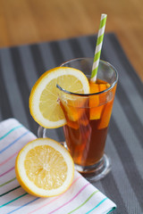 Lemon tea in glass on wooden table