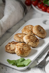 Chicken cutlets on white Board on white background
