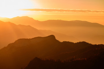 Landscape with mountains and the sun. Sunset. Mountain landscape. Abstract background