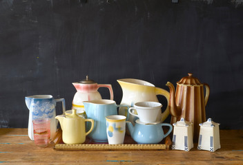 vintage tableware, coffee pots,mugs coffee filter on dark background, good copy space