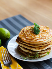 Fresh, delicious pancakes with walnuts on wooden table