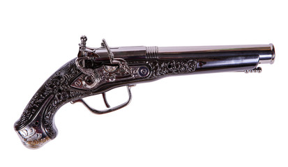 Model of the old gun on the white background, souvenir