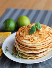 Fresh, delicious pancakes with walnuts on wooden table