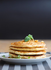 Fresh, delicious pancakes with walnuts on wooden table