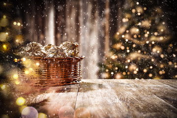 Christmas balls on table and snowflakes 
