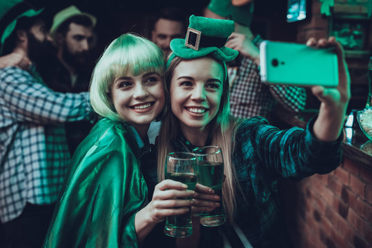 Friends doing selfie at Saint Patrick's Day at pub