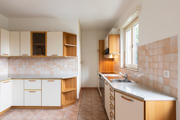 Vintage kitchen with wooden wall units